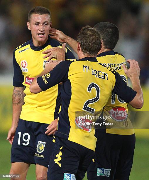 Mitchell Duke of the Mariners celebrates a goal with team-mates Daniel McBreen and Nick Montgomery during the round 18 A-League match between the...