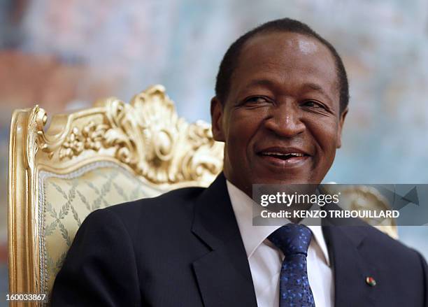 Burkina Faso's President Blaise Compaore smiles on January 23, 2013 during a meeting with France's Junior Minister for Foreign Countries and...