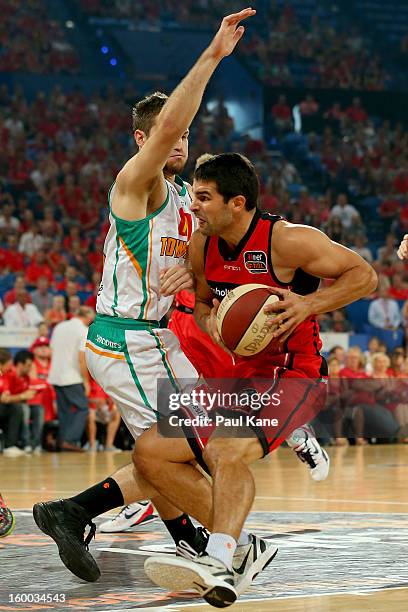 Kevin Lisch of the Wildcats is pulls up against Mitch Norton of the Crocodiles during the round 16 NBL match between the Perth Wildcats and the...