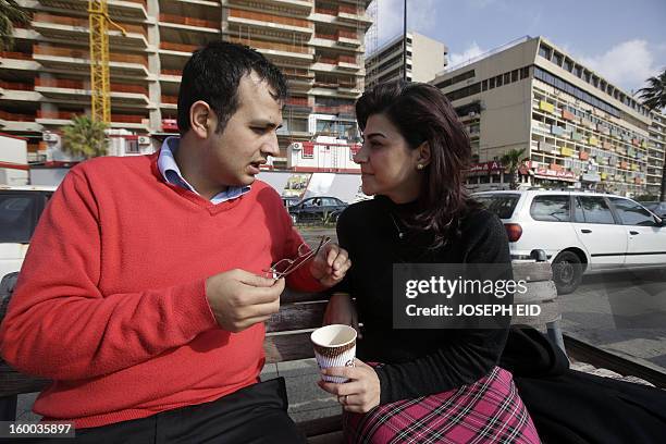 Kholoud Sukkariyeh and Nidal Darwish, who got married in defiance of Lebanon's ban on civil unions, drink coffee next to Beiurt's landmark Pigeon...