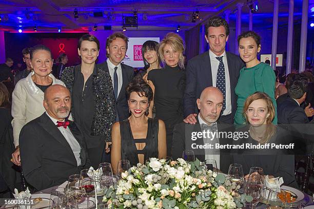 Guest, Christian Louboutin, Juliette Binoche, Stephane Bern, Farida Khelfa, Anne-Florence Schmitt, and Virginie Ledoyen and guests attend the...