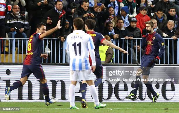 Gerard Pique of Barcelona celebrates with team-mates after scoring his team's second goal during the Copa del Rey quarter final second leg match...