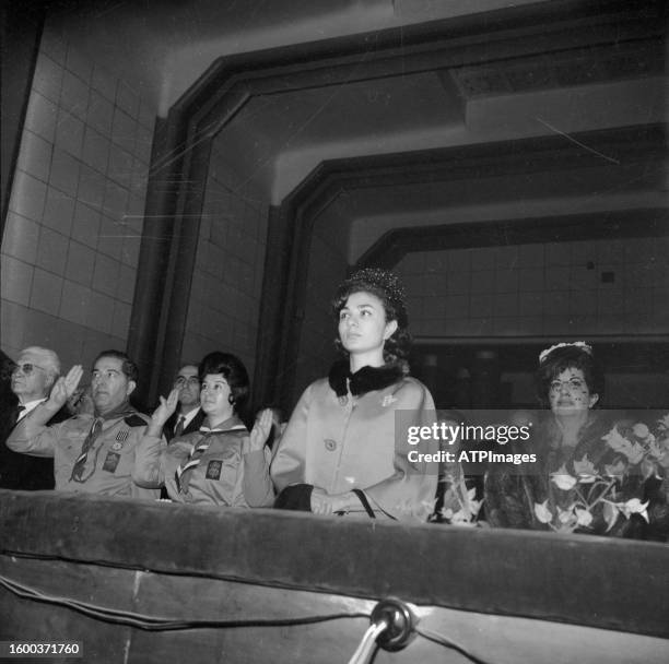 Amanullah Jahanbani and Farah Pahlavi attend an Ivan scout Organization ceremony on 1960s in Tehran, Iran.