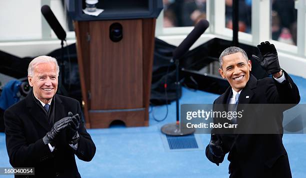 President Barack Obama and U.S. Vice President Joe Biden applaud during the presidential inauguration on the West Front of the U.S. Capitol January...