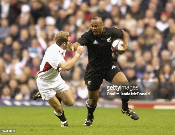 Jonah Lomu of New Zealand goes past James Simpson-Daniel of England during the England v New Zealand Investec Challenge match on 09 November, 2002 at...