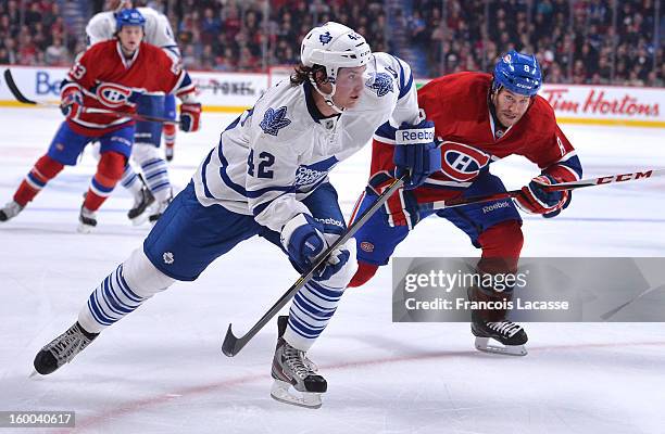 Tim Connolly of Toronto Leafs and Brandon Prust of Montreal Canadians battle for position during the NHL game on on January 19, 2013 at the Bell...