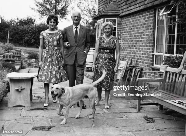 Rear Admiral Sir Matthew Slattery , Lady Mica Slattery , daughter Micaela and the family's Labrador Retriever at home near Warninglid in West Sussex,...