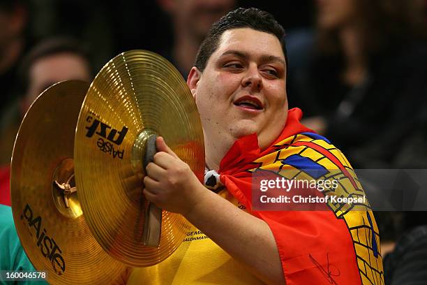 Fan of Spain plays music prior to the Men's Handball World Championship 2013 semi final match between Spain and Slovenia at Palau Sant Jordi on...