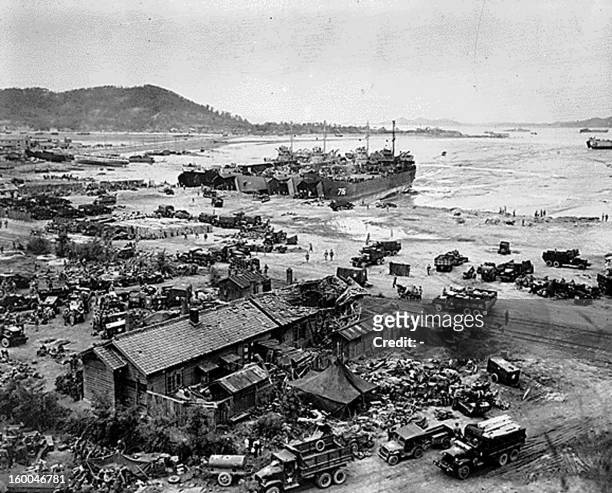 This 15 September 1950 photo shows US military vehicles and equipment being unloaded from LST's on the beach during the invasion of Inchon, Korea....