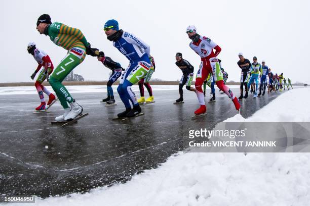 Participants of the National Championship Marathon at the Veluwemeer compete near Elburg, The Netherlands, on January 25, 2013. Due to cold, mist and...