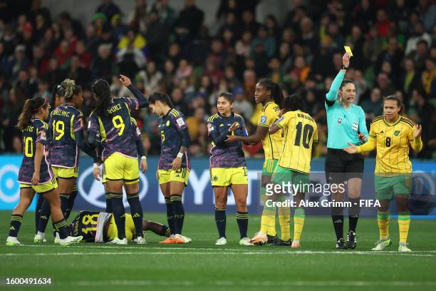 Drew Spence of Jamaica is shown a yellow card by Referee Kate Jacewicz after fouling Linda Caicedo of Colombia during the FIFA Women's World Cup...