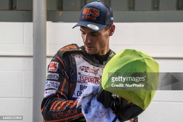 Steve Worrall cleans his helmet for his next heat during the Sports Insure British Speedway Final at the National Speedway Stadium, Manchester on...