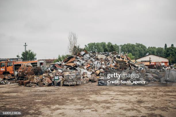 landfill and recycling centre full with sorted garbage that is ready for recycling - junkyard stock pictures, royalty-free photos & images