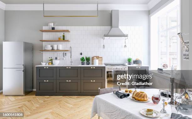 classic elegant interior - a modern, but classic kitchen with a gray and white wall background, full dining table and french-style windows - brightly lit kitchen stock pictures, royalty-free photos & images