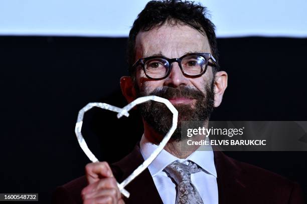 Screen writer and producer Charlie Kaufman receives and holds honorary "Heart of Sarajevo" award for exceptional life-time contribution to the art of...