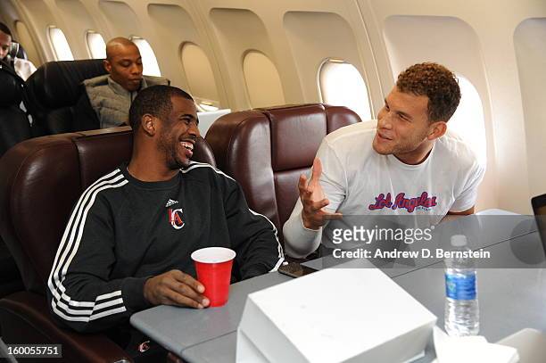 Chris Paul and Blake Griffin of the Los Angeles Clippers on the plane before the game against the Phoenix Suns on January 24, 2013 in Phoenix,...