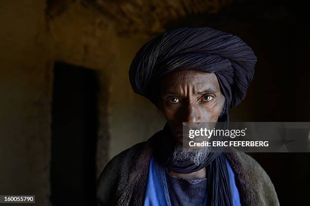 Ali Ag Noh poses on January 25, 2013 in his home in the village of Seribala, 20 kms from Niono, about 350 kms northeast of the capital Bamako after...