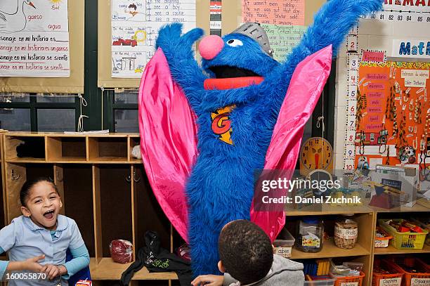 Super Grover teaches kids to be a super hero at the WHEDCo classroom on January 24, 2013 in New York City.