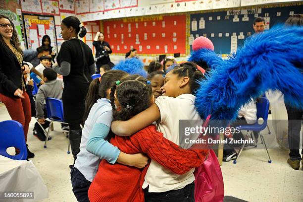 Super Grover teaches kids to be a super hero at the WHEDCo classroom on January 24, 2013 in New York City.