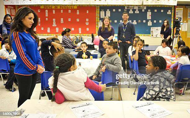 Knicks dancer Dominique teaches kids to be a super hero at the WHEDCo classroom on January 24, 2013 in New York City.