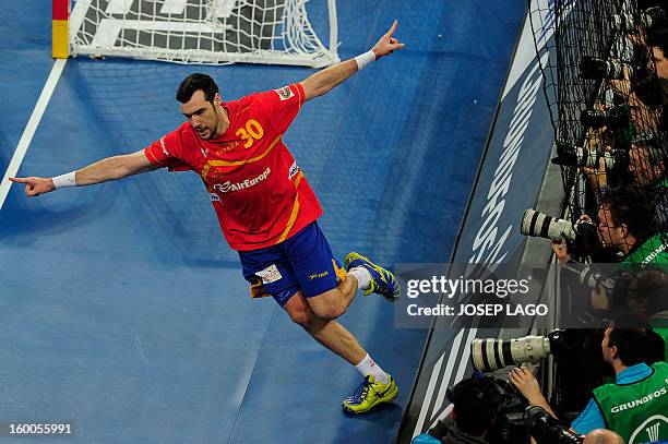Spain's pivot Gedeon Guardiola celebrates after scoring during the 23rd Men's Handball World Championships semifinal match Spain vs Slovenia at the...