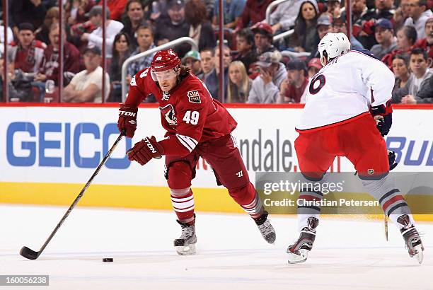 Alex Bolduc of the Phoenix Coyotes skates with the puck during the NHL game against the Columbus Blue Jackets at Jobing.com Arena on January 23, 2013...