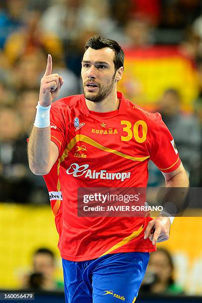Spain's pivot Gedeon Guardiola celebrates after scoring during the 23rd Men's Handball World Championships semifinal match Spain vs Slovenia at the...
