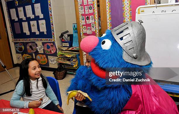 Super Grover teaches kids to be a super hero at the WHEDCo classroom on January 24, 2013 in New York City.