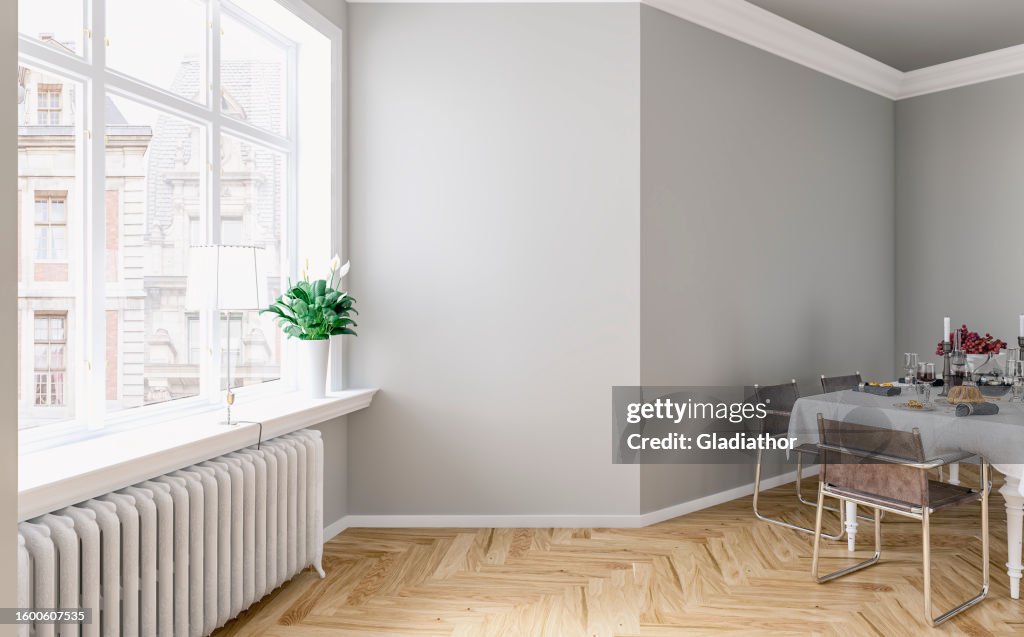 Side view of an empty classic elegant interior - a modern, but classic dining room with a gray and white wall background, full dining table, and French-style windows with a city view