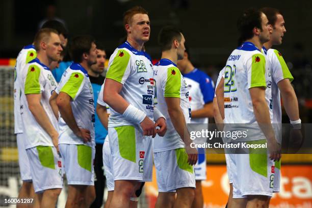Matej Gaber and Uros Zorman of Slovenia look dejected after losing 22-26 the Men's Handball World Championship 2013 semi final match between Spain...