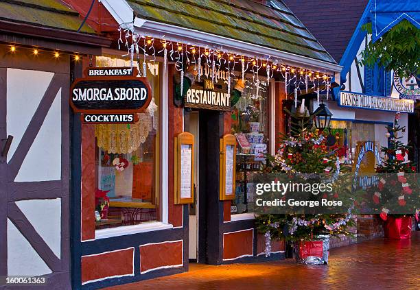 Downtown business is decked out with holiday lights and decorations on December 26 in Solvang, California. Though much of the religious aspects to...