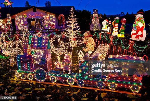 Downtown home is decked out with holiday lights and decorations on December 17 in Healdsburg, California. Though much of the religious aspects to...