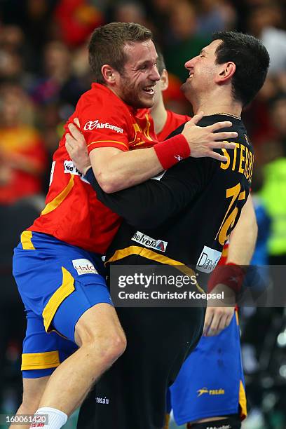 Victor Tomas and Arpad Sterbik of Spain celebrate the 26-22 victory after the Men's Handball World Championship 2013 semi final match between Spain...
