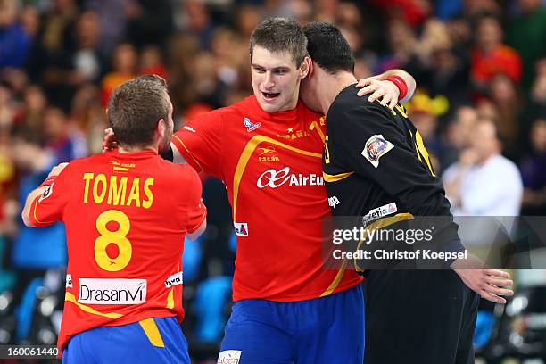 Victor Tomas, Julen Aguinagalde and Arpad Sterbik of Spain celebrate the 26-22 victory after the Men's Handball World Championship 2013 semi final...