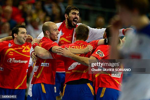 Spain's right wing Albert Rocas and Spain's right back Jorge Maqueda celebrate with teammates affter winning the 23rd Men's Handball World...