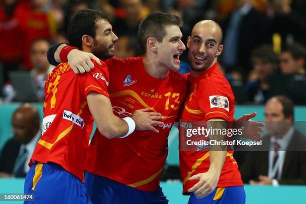 Joan Canellas, Julen Aguinagalde and Albert Roca of Spain celebrate the 26-22 victory after the Men's Handball World Championship 2013 semi final...