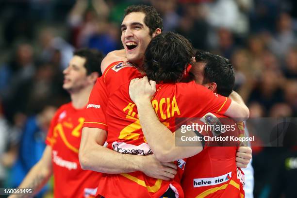 Angel Montoro, Antonio Garcia and Carlos Ruesga of Spain celebrate the 26-22 victory after the Men's Handball World Championship 2013 semi final...