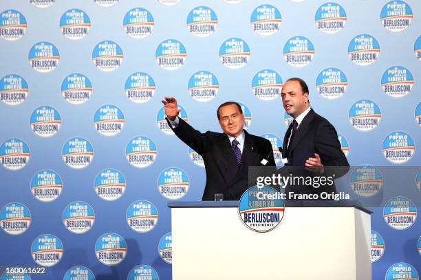 Silvio Berlusconi , flanked by the secretary general of Popolo della Liberta party Angelino Alfano , attends a meeting with candidates ahead of the...