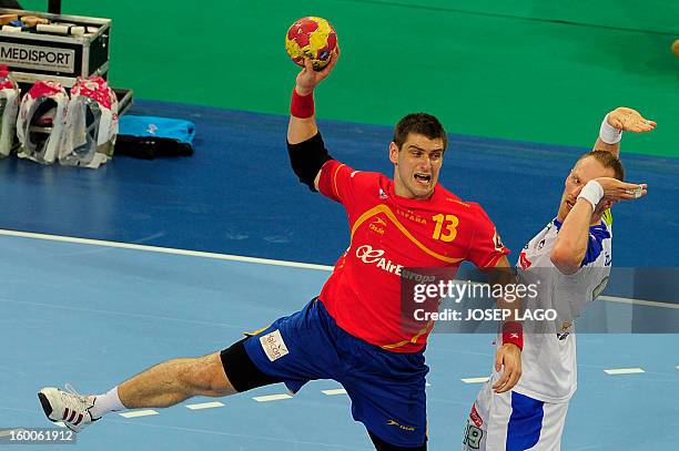 Spain's pivot Julen Aguinagalde shoots during the 23rd Men's Handball World Championships semifinal match Spain vs Slovenia at the Palau Sant Jordi...