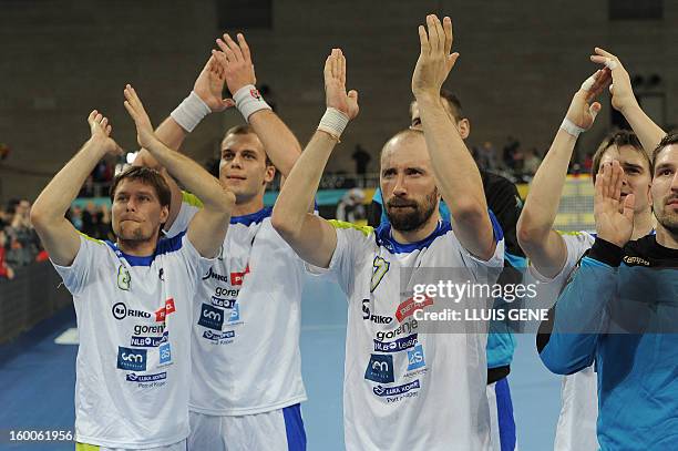 Slovenian handball players reacts att he end of the 23rd Men's Handball World Championships semifinal match Spain vs Slovenia at the Palau Sant Jordi...