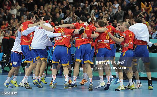 Spanish handball players celebrate their victory at he end of the 23rd Men's Handball World Championships semifinal match Spain vs Slovenia at the...