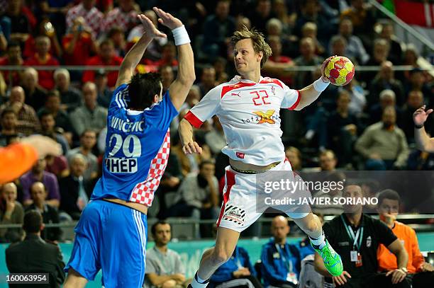 Denmark's right back Kasper Sondergaard shoots past Croatia's Ivan Nincevic during the 23rd Men's Handball World Championships semifinal match...
