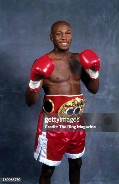 Tim Austin Cross Tim Austin poses for a portrait with his belt in 1998 in New York ...