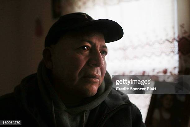 Luis Serrano sits in his freezing apartment in the Rockaways after losing heat following Hurricane Sandy on January 25, 2013 in New York City. Three...