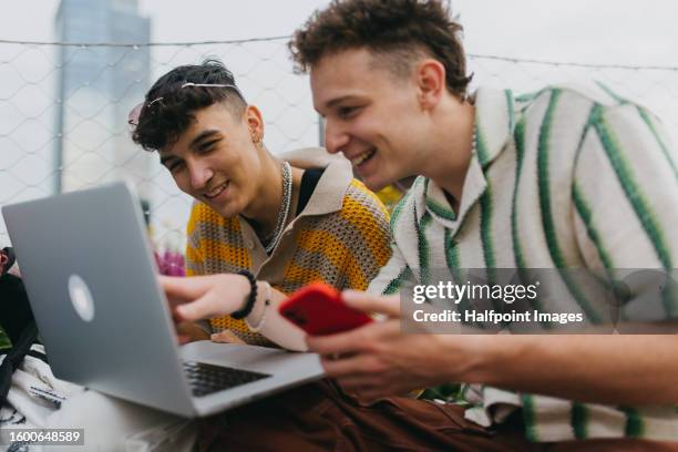 young stylish generation z boys studying together outdoors after school. - lunch and learn stock pictures, royalty-free photos & images