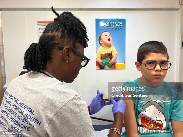 Silvano Castillo gets ready to start school in Broward County with a physical exam from Valerie Boyd at the Joe DiMaggio Children's Mobile Health...