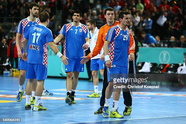 Lovro Sprem, Luka Stepancic, Filip Ivic and Ivan Nincevic of Croatia look dejected after losing 30-24 the Men's Handball World Championship 2013 semi...