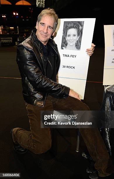 Awards Committee member actor Scott Bakula poses next to the place card of actress Tina Fey during the 19th Annual Screen Actor Guild Awards ceremony...