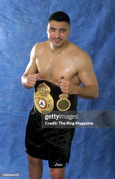 John Ruiz poses for a portrait with his belt in 2001 in New York.