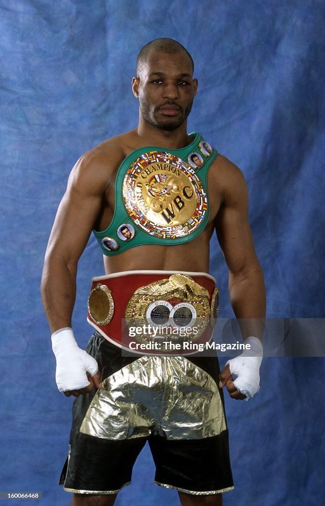 Bernard Hopkins poses for a portrait with his belts in 2003 in New